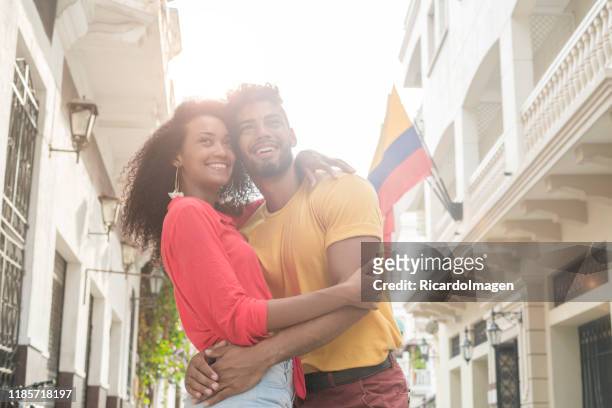 latino couple hugging in downtown cartagena - colombia stock pictures, royalty-free photos & images
