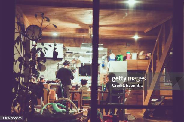 log cabin seen through the window - camping indoors stock pictures, royalty-free photos & images