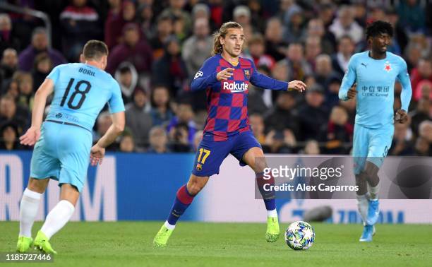 Antoine Griezmann of FC Barcelona battles for possession with Jan Boril of Slavia Praha during the UEFA Champions League group F match between FC...