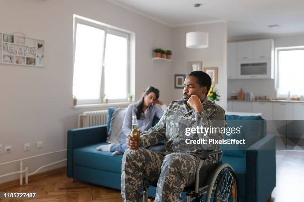 depressed veteran in a wheelchair - drunk husband stock pictures, royalty-free photos & images