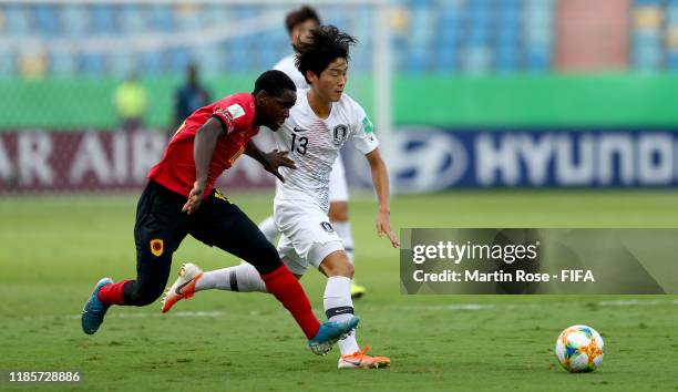 Zito of Angola challenges Ryunseong Kim of Korea Republic during the FIFA U-17 World Cup Brazil 2019 round of 16 match between Angola and Korea...