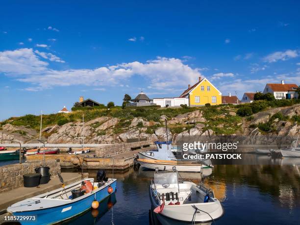 fishing boats moored in little port of svaneke, bornholm island, denmark. - bornholm island stock pictures, royalty-free photos & images