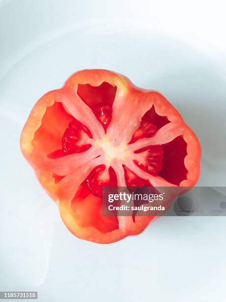half beefsteak tomato from above - beefsteak tomato stock pictures, royalty-free photos & images