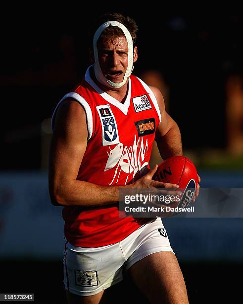 Wayde Twomey of the Bullants gathers the ball during the round 15 VFL match between Sandringham and the Northern Bullants at Trevor Barker Beach Oval...