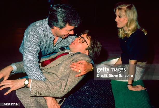 View of, from left, American film director Peter Bogdanovich, actor John Ritter , and Canadian actress Dorothy Stratten on the set of their film...