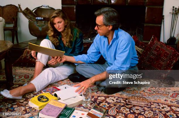 Canadian teenager Louise Hoogstraten and American film director Peter Bogdanovich sit on the floor as they talk together , Los Angeles, California,...