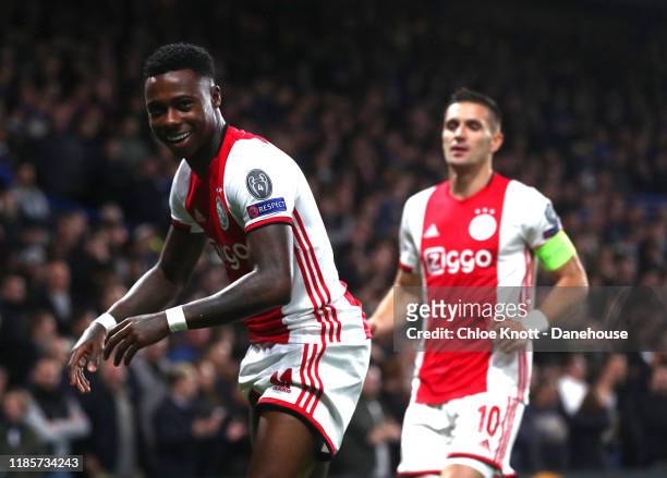 Quincy Promes of Ajax celebrates scoring his teams first goal during the UEFA Champions League group H match between Chelsea FC and AFC Ajax at...