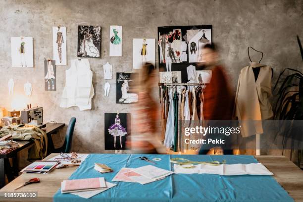 busy day in fashion designer studio - fashion studio stock pictures, royalty-free photos & images