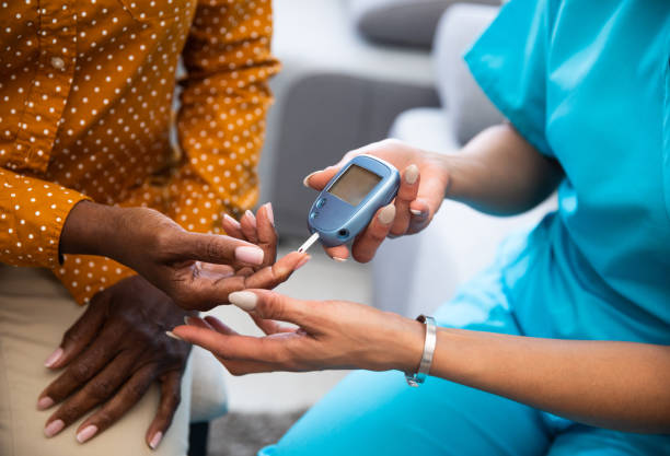 Woman receiving a glucose level blood test 