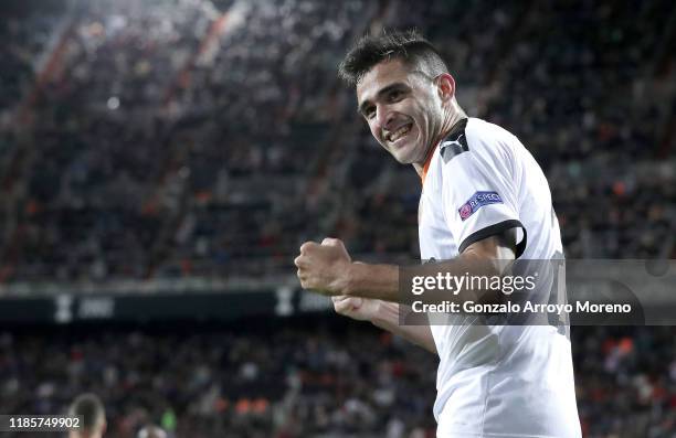 Maximiliano Gomez of Valencia celebrates his team's second goal which was an own goal by Adama Soumaoro of Lille OSC during the UEFA Champions League...