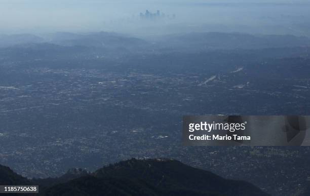 The buildings of downtown Los Angeles are partially obscured at midday on November 5, 2019 as seen from Pasadena, California. The air quality for...