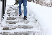 In winter it is dangerous to walk up a snow-covered staircase