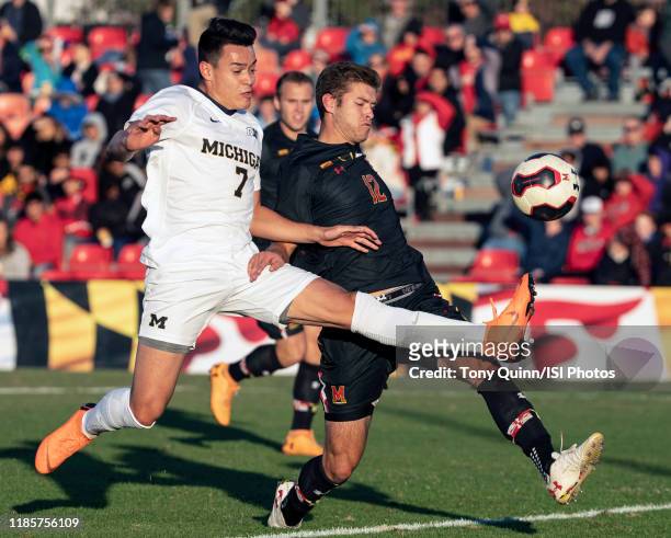 Derick Broche of Michigan and Brett St. Martin of Maryland in action during a game between Michigan and Maryland at Ludwig Field on November 03, 2019...