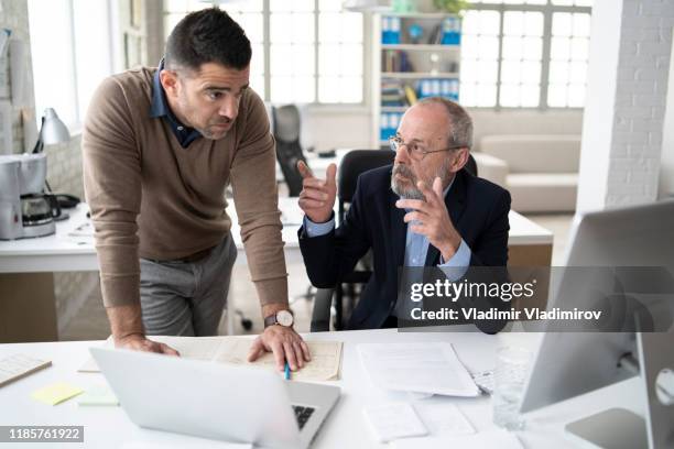 two men discussing problems at workplace - bossy leader stock pictures, royalty-free photos & images