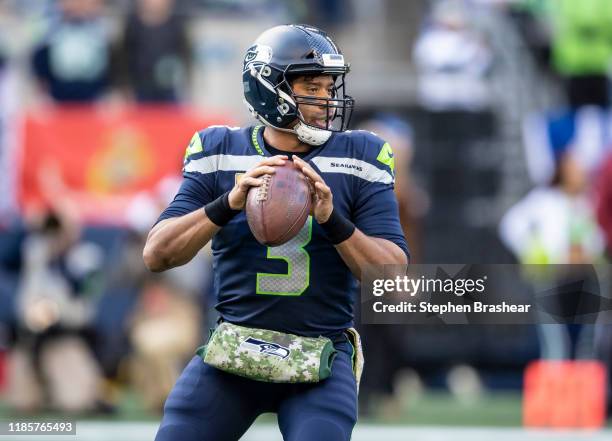 Quarterback Russell Wilson of the Seattle Seahawks drops back to pass during a game against the Tampa Bay Buccaneers at CenturyLink Field on November...