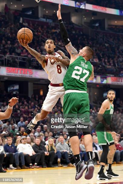 Jordan Clarkson of the Cleveland Cavaliers shoots over Daniel Theis of the Boston Celtics during the first half at Rocket Mortgage Fieldhouse on...