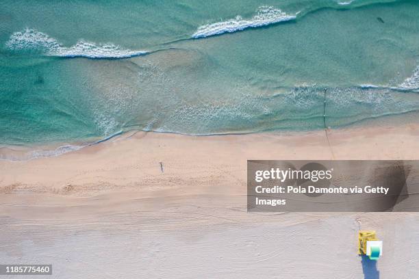 aerial drone view of south beach lifeguard tower and beach, miami, florida at sunrise - miami background stock pictures, royalty-free photos & images