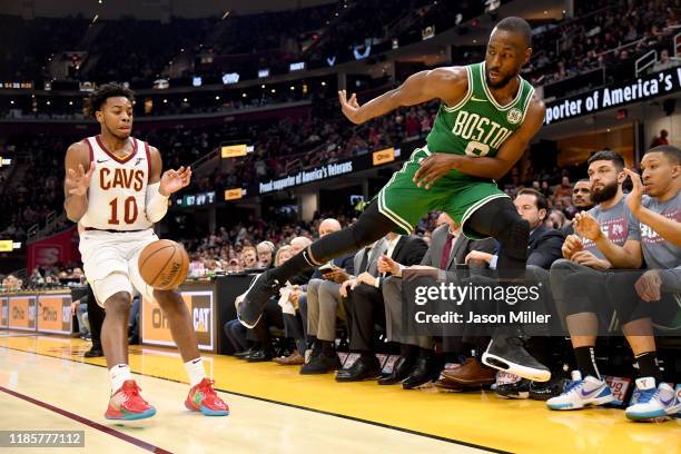 Kemba Walker of the Boston Celtics makes a leaping throw at Darius Garland of the Cleveland Cavaliers during the second half at Rocket Mortgage...