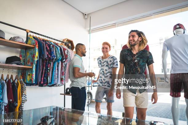 people entering the clothing store - entering shop stock pictures, royalty-free photos & images
