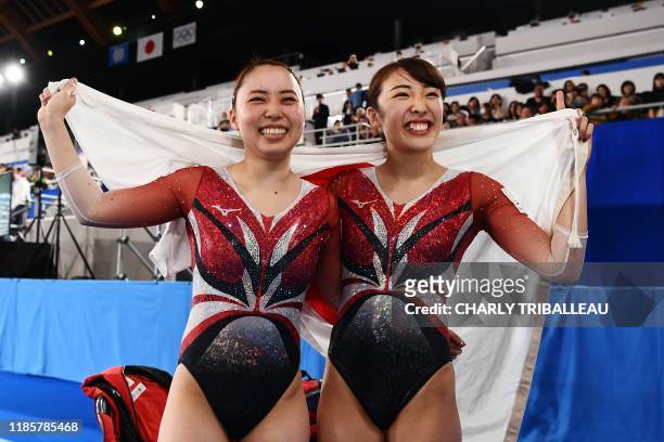 Hikaru Mori of Japan and Chisato Doihata of Japan react during the World Trampoline Gymnastics Championships at the Ariake Gymnastics Centre in Tokyo...