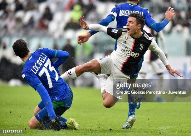 Foul on Paulo Dybala of Juventus by Manuel Locatelli of US Sassuolo during the Serie A match between Juventus and US Sassuolo on December 1, 2019 in...