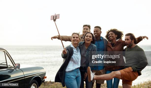 time to take in the sunset but first a selfie - selfie stick stock pictures, royalty-free photos & images