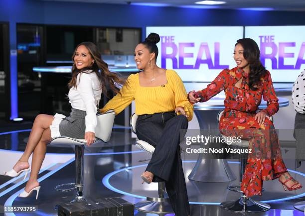 Adrienne Bailon, Tamera Mowry-Housley and Jeannie Mai visit "Extra" at Burbank Studios on November 05, 2019 in Burbank, California.