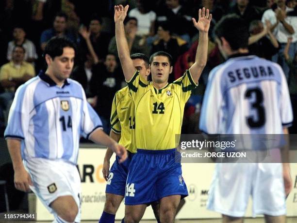 Vander , of the Brazilian Soccer lifts his hands after a goal was scored for his team against Argentina, during a game for the IV Mundial de Futsal,...