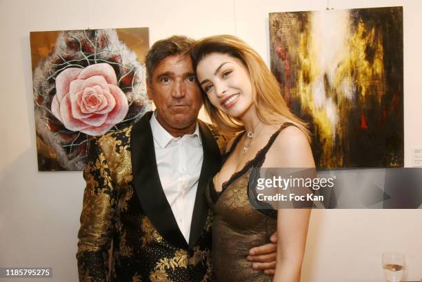Luigi di Donna from Red Collector magazine and Model/jewelry designer and blogger Celine Morel attend the "Overview" exhibition preview by David...