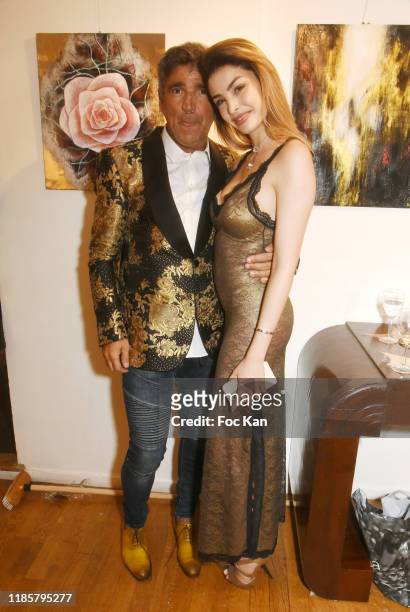 Luigi di Donna from Red Collector magazine and Model/jewelry designer and blogger Celine Morel attend the "Overview" exhibition preview by David...