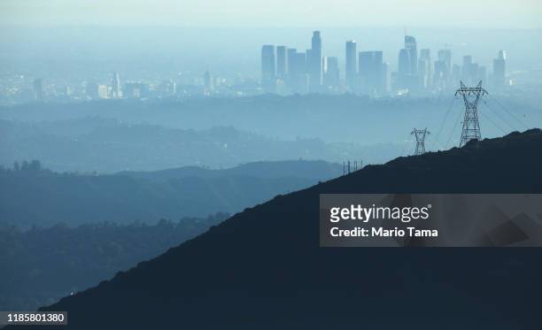 The buildings of downtown Los Angeles are partially obscured in the afternoon on November 5, 2019 as seen from near Pasadena, California. The air...