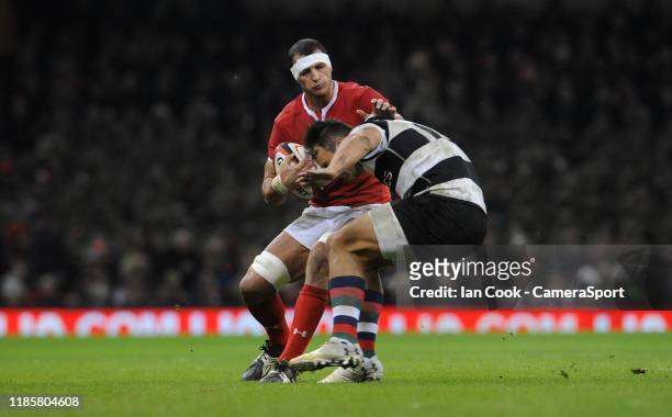 Wales Aaron Shingler gets away from Barbarians Curwin Bosch during the Autumn International match between Wales and Barbarians at Principality...