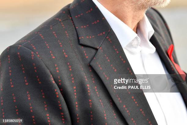 Opposition Labour Party leader Jeremy Corbyn wears a jacket with their slogan "For The Many Not The Few" sown into the cloth in Whitby, northern...