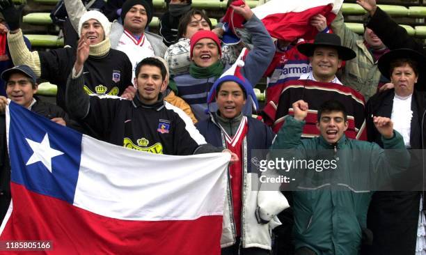 Fans of the Under-20 Chilean soccer team, celebrate as their team enters the field, before the game against Ukraine, 17 June 2001, at the Malvinas...