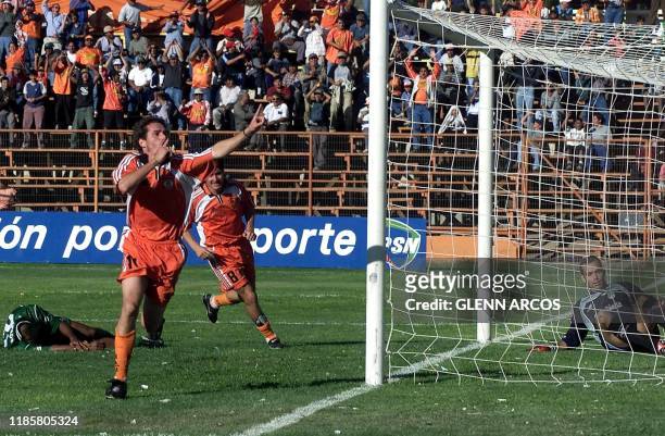 Nicolas Tagliani celebrates the first goal for the Cobreloa team against Deportivo Cali, in the game played 04 April 2001 in Calama, Chile, for the...