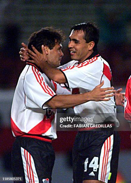 Celso Ayala celebrates his team's first goal with his teammate Pedro Saravia in Buenos Aires, Argentina, 18 April 2001, in a game against El Nacional...