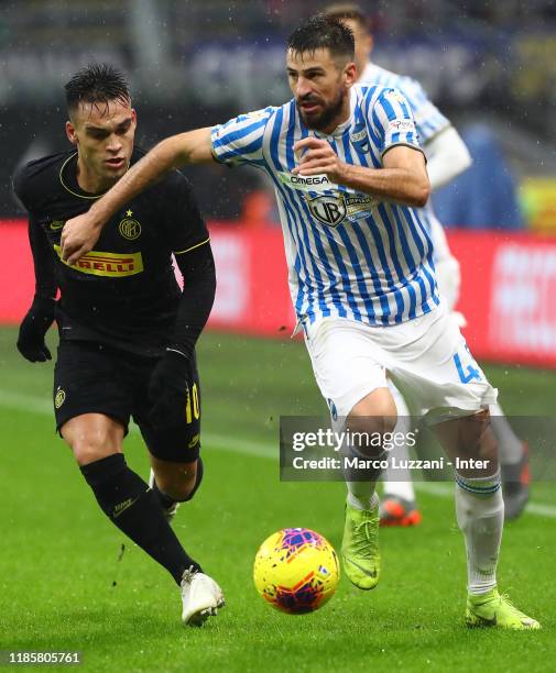 Lautaro Martinez of FC Internazionale competes for the ball with Nenad Tomovicof SPAL during the Serie A match between FC Internazionale and SPAL at...