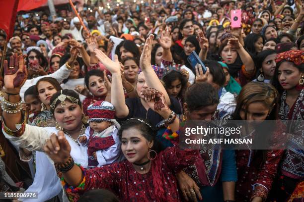 People celebrate the annual Sindhi Cultural Day to highlight the ancient culture of Sindh rooted in the Indus Valley Civilization of Bronze Age, in...