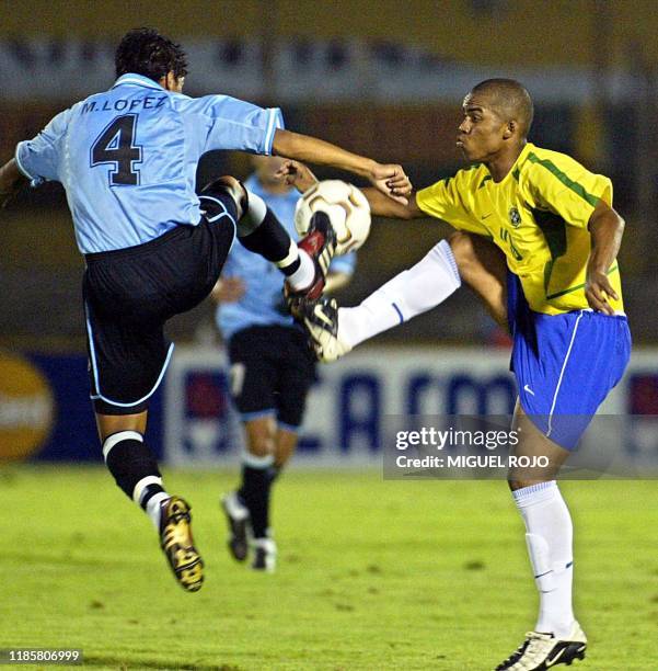 Carlos Alberto of Brazil's soccer team battles for the ball with Uruguayan Marcelo Lopez, 28 January 2003, in Montevideo, Uruguay. Carlos Alberto de...