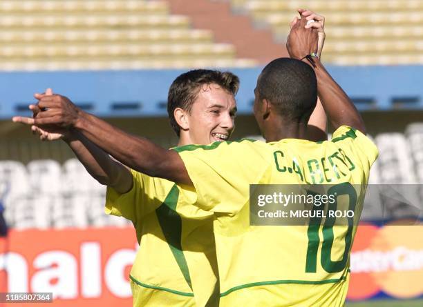 Dagoberto Pelentier , celebrates the goal he scored with teammate Carlos Alberto of the Brazilian team, against Bolivia, 07 January 2003 at the...