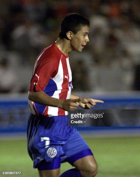 Erwin Avalos of the Paraguayan soccer team, celebrates his first goal against the Venezuelan team, 08 January 2002, during a game for the South...
