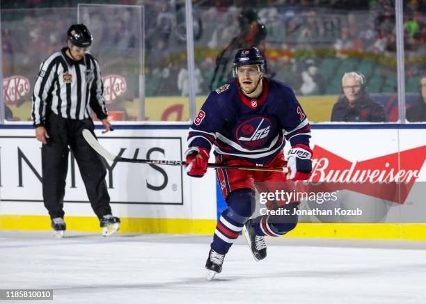 Bryan Little of the Winnipeg Jets follows the play during third period action against the Calgary Flames during the 2019 Tim Hortons NHL Heritage...