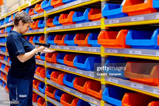 woman holding barcode reader - filing tray stock pictures, royalty-free photos & images