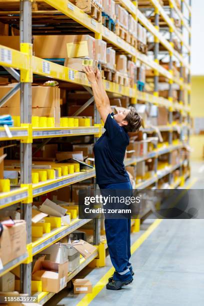 Propper Reaching Woman Reaching Into Box Photos and Premium High Res Pictures - Getty Images
