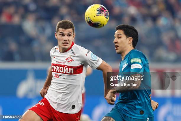 Sebastian Driussi of FC Zenit Saint Petersburg and Roman Zobnin of FC Spartak Moscow vie for the ball during the Russian Premier League match between...