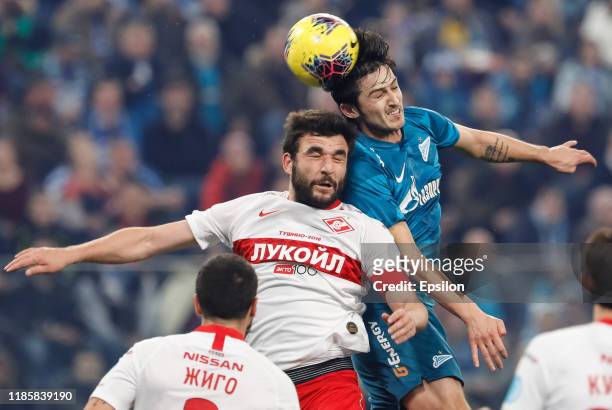 Sardar Azmoun of FC Zenit Saint Petersburg and Georgi Dzhikiya of FC Spartak Moscow vie for a header during the Russian Premier League match between...