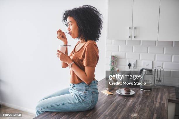 every spoonful tastes like more - breakfast lifestyle female imagens e fotografias de stock