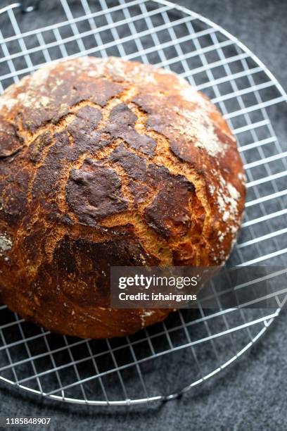 freshly home made baked sourdough bread - round loaf stock pictures, royalty-free photos & images