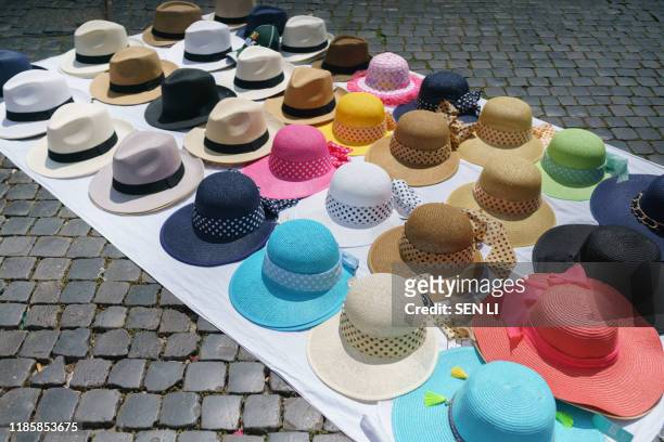 colorful round hats on the floor - white hat fashion item - fotografias e filmes do acervo