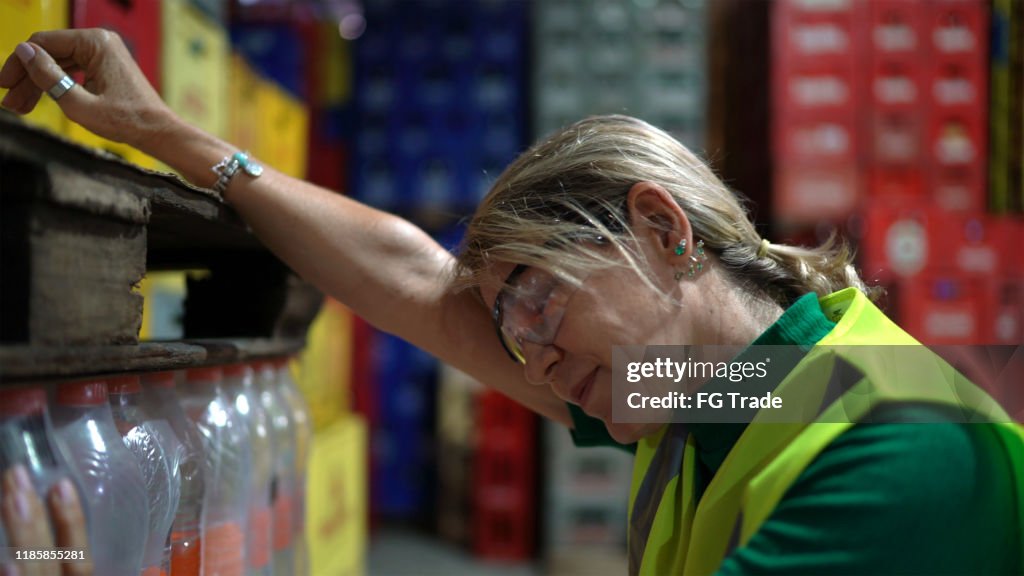 Exhausted employee at warehouse